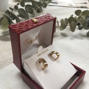14 k solid gold half hoop earrings.